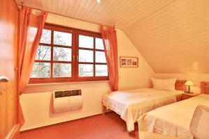 Ένα ή περισσότερα κρεβάτια σε δωμάτιο στο Ferienhaus Seeweg Ferienhaus Seeweg 4