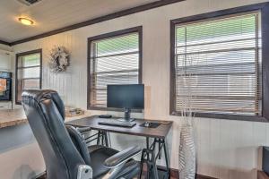 an office with a desk with a computer and two windows at Coastal Cottage - 4 Blocks to Surfside Beach! in Freeport