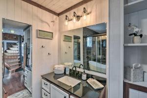 a bathroom with a sink and a mirror at Walk to Shore: Cottage w/ Deck in Surfside Beach! in Freeport +17 photos