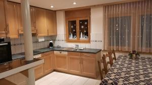 Kuchyň nebo kuchyňský kout v ubytování Aquarell Apartments