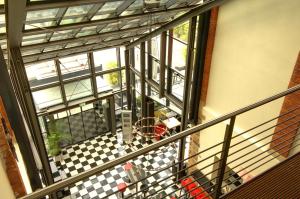 a balcony with a checkered floor at nestor Hotel Stuttgart-Ludwigsburg in Ludwigsburg