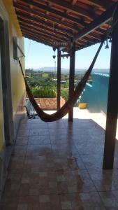 a hammock in a room with a view at Alta Vista in Penedo