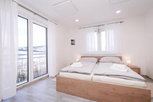 Postel nebo postele na pokoji v ubytování Apartmán Hugo Klínovec