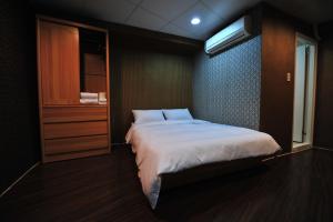 Cama o camas de una habitación en Jing Don B