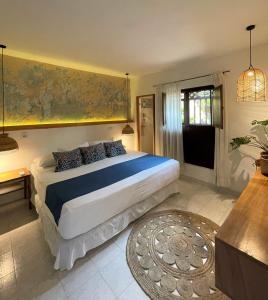 A bed or beds in a room at Hotel Casa de Verano - Solo adultos -