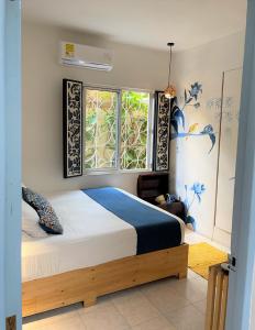 Ένα ή περισσότερα κρεβάτια σε δωμάτιο στο Hotel Casa de Verano - Solo adultos -