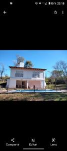 a picture of a white building in front of aermottermottermott at Casa Blanca in Villa Rumipal