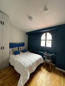 Rúm í herbergi á Kokoa Hotel Cusco