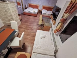 Postel nebo postele na pokoji v ubytování Pension Föhrenhain