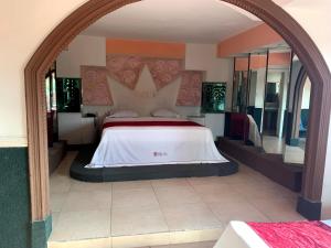 Postel nebo postele na pokoji v ubytování Hotel Rio Inn