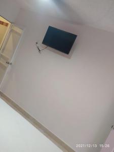 a glass table with a laptop on top of it at Hotel Bello Caribe Express in Cozumel