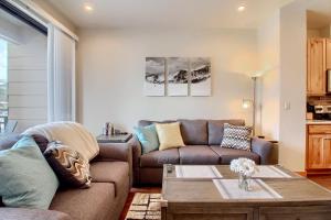 a living room with a couch and a coffee table at Arrow at Winter Park Unit 286 in Winter Park