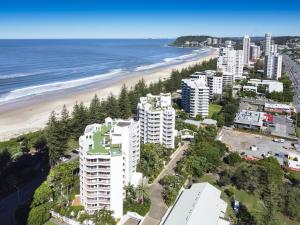 an aerial view of a beach and buildings at ULTIQA Burleigh Mediterranean Resort in Gold Coast