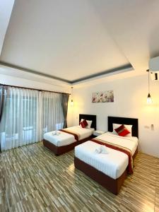 Postel nebo postele na pokoji v ubytování Khaosok Good view Resort - SHA PLUS
