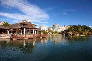 a large body of water with buildings in the background at The Empire Brunei in Bandar Seri Begawan