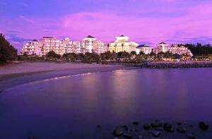 a view of a resort from the beach at night at The Empire Brunei in Bandar Seri Begawan