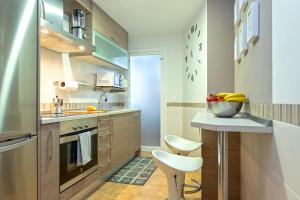 a kitchen with a bowl of fruit on a counter at Marbella in Love in Marbella +16 photos