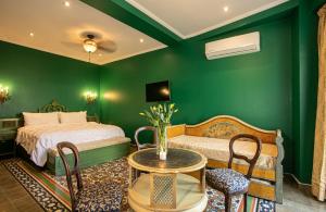 Llit o llits en una habitació de Hotel Boutique Rivera Del Rio