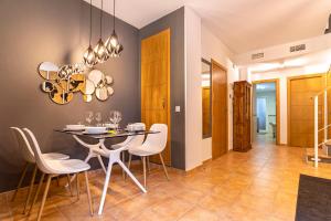 a dining room with a table and chairs at Marbella in Love in Marbella