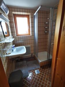 a bathroom with a shower and a sink at Haus Gamssprung in Steinberg am Rofan