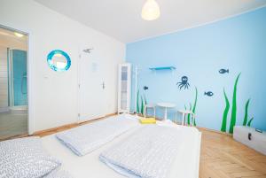 
a room with a blue wall and a blue floor at Patio Hostel in Bratislava
