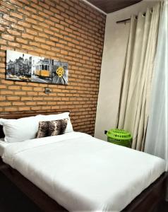 Ένα ή περισσότερα κρεβάτια σε δωμάτιο στο SUGIRA ECO-RESORT