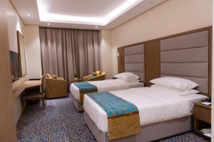Letto o letti in una camera di ROZANA HOTEL