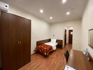 Postel nebo postele na pokoji v ubytování Nadezhda Hotel