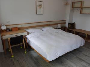 Postel nebo postele na pokoji v ubytování Lanshan Guest House