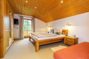 Postel nebo postele na pokoji v ubytování Chalet Bergromantik