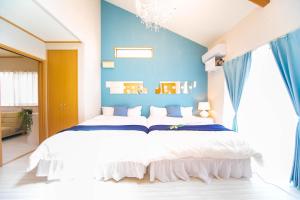 Postel nebo postele na pokoji v ubytování Awaji Seaside Resort Kuruma52
