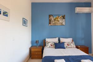 Postel nebo postele na pokoji v ubytování Pigi Paradise Residence
