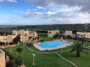 Bazén v ubytování Pigi Paradise Residence nebo v jeho okolí