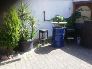 a patio with plants and a table and chairs at Apartment-EG-04 in Darmstadt