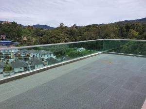 a balcony with a view of a city at Paradise Penthouse 5 bedrooms 5 bathrooms in Tanah Rata