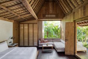 Tempat tidur dalam kamar di The Asa Maia - Adults Only Resort