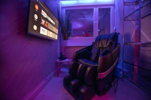 a barbershop with a chair and a sign on a wall at Aurora Lux Spa Smart apartments in Belgrade +101 photos