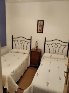 Postel nebo postele na pokoji v ubytování Casa Rural el Maestro II