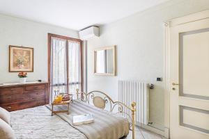 Cama ou camas em um quarto em I Mosaici Apartments by Wonderful Italy