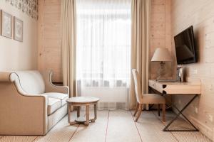 Televízia a/alebo spoločenská miestnosť v ubytovaní Aries Hotel & SPA Zakopane