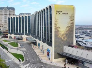 a hotel with a sign on the side of a building at Maison L'OCCITANE in Macau