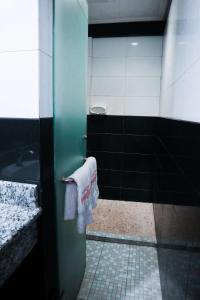A bathroom at Helios Hotel Malang