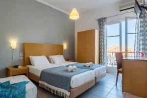 A bed or beds in a room at Argo Pension