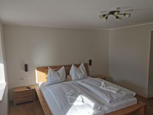 Łóżko lub łóżka w pokoju w obiekcie Premium Appartements Di Bora