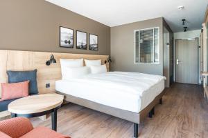Ein Bett oder Betten in einem Zimmer der Unterkunft aja Garmisch-Partenkirchen