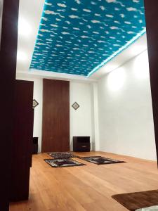 A television and/or entertainment centre at Helios Hotel Malang