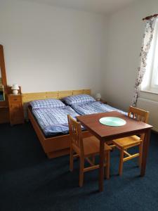 Postel nebo postele na pokoji v ubytování penzion Poutník