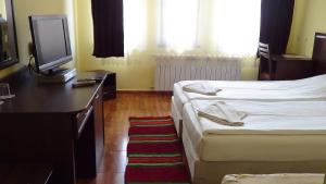 Postel nebo postele na pokoji v ubytování Family Hotel Medven - 1