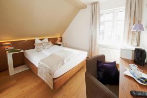 Postel nebo postele na pokoji v ubytování Hotel Nordwind