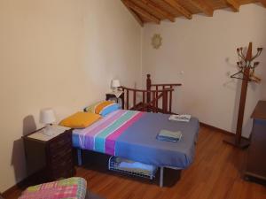 Giường trong phòng chung tại Casa do Rio 1